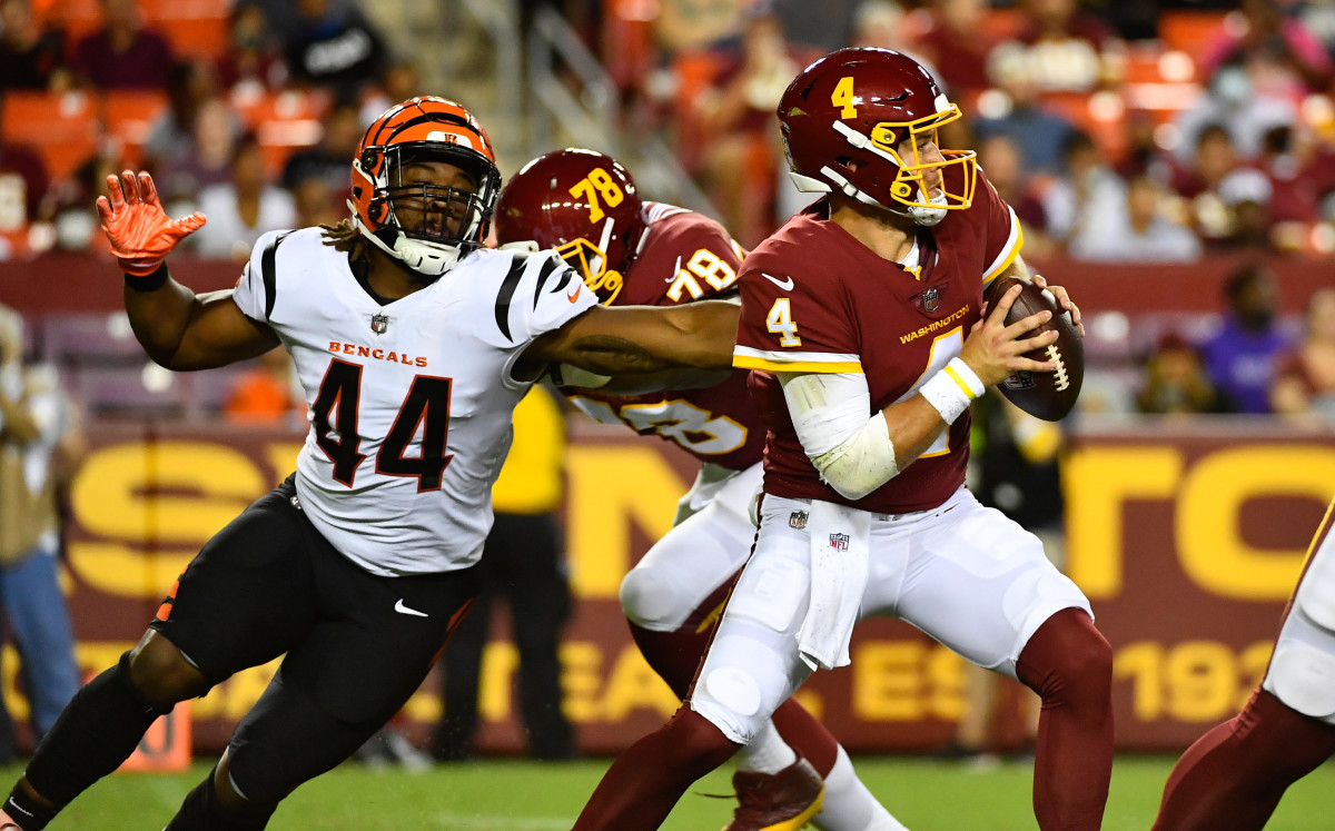 Aug 20, 2021; Landover, Maryland, USA; Cincinnati Bengals linebacker Darius Hodge (44) pressures Washington Football Team quarterback Taylor Heinicke (4) during the second quarter at FedExField. Mandatory Credit: Brad Mills-USA TODAY Sports